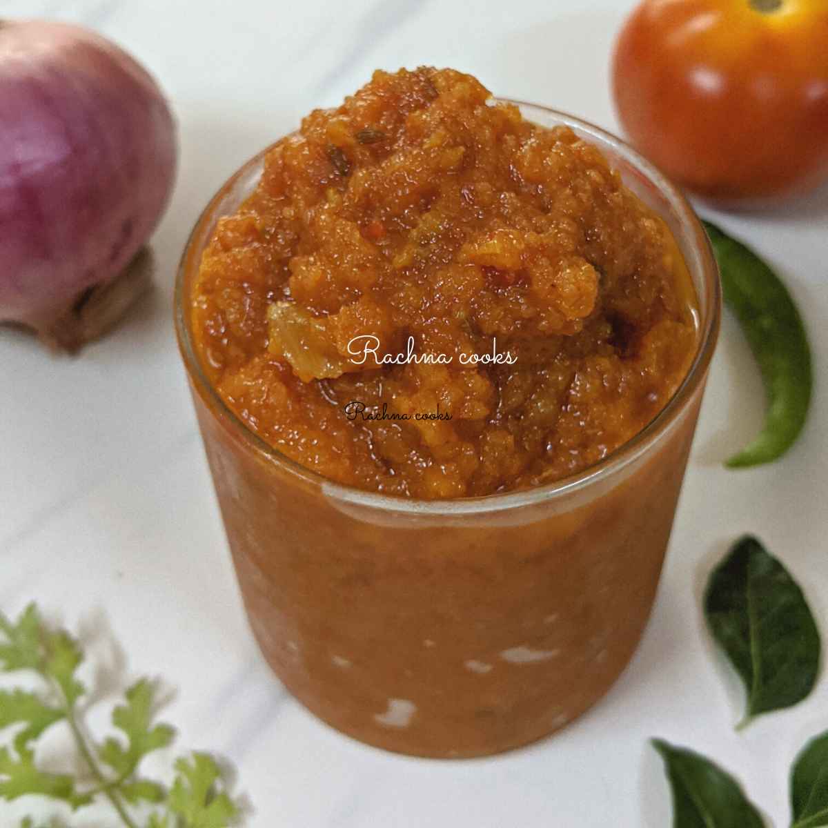 Curry masala paste or bhuna masala in a shallow glass.