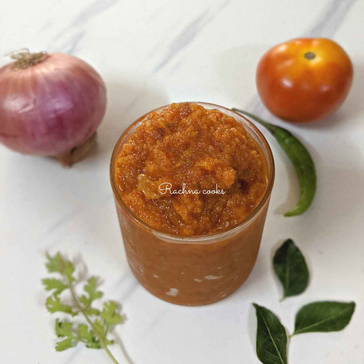 Curry masala paste or bhuna masala in a shallow glass.