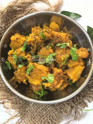 Pumpkin curry in a wok garnished with cilantro