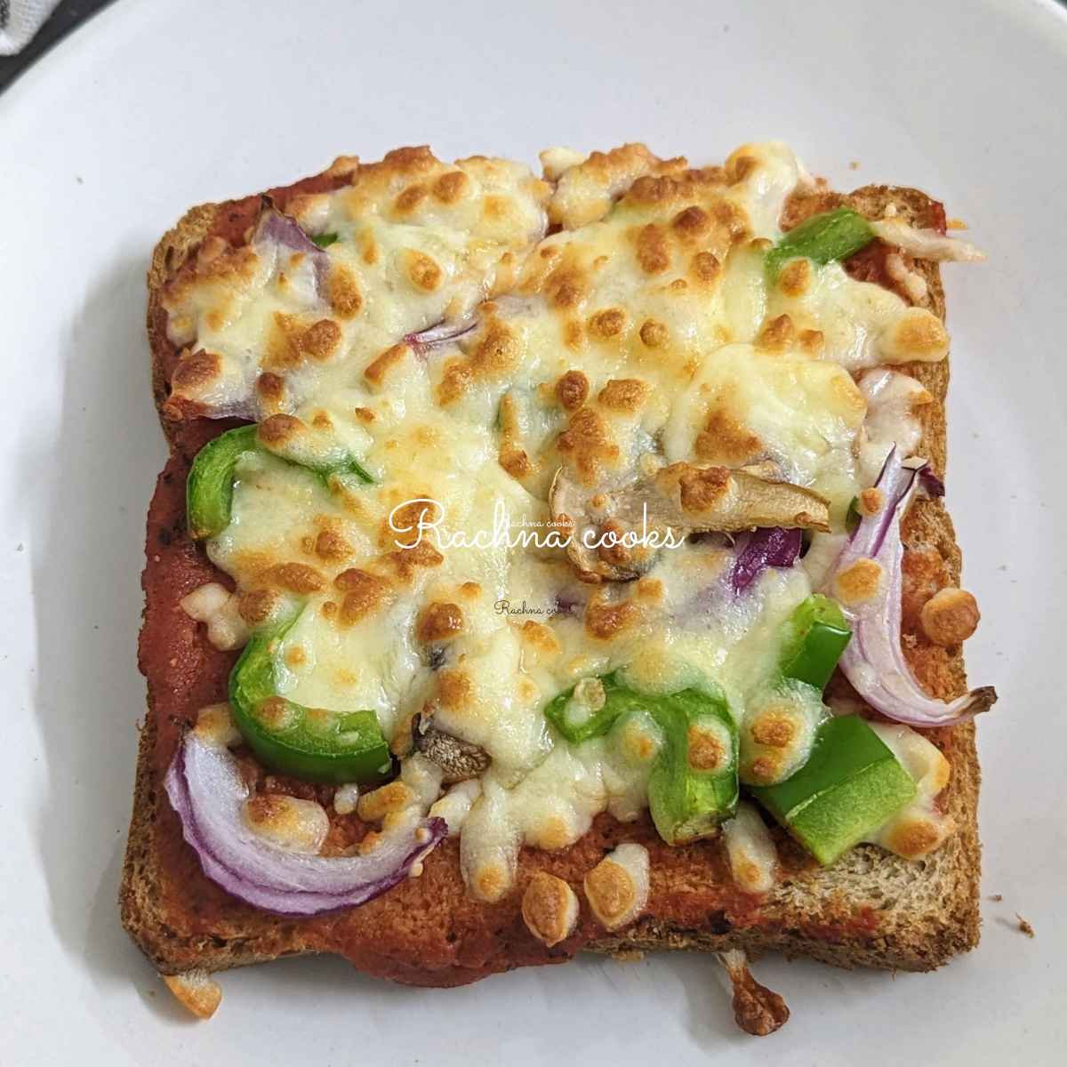 One slice of bread pizza on a white plate