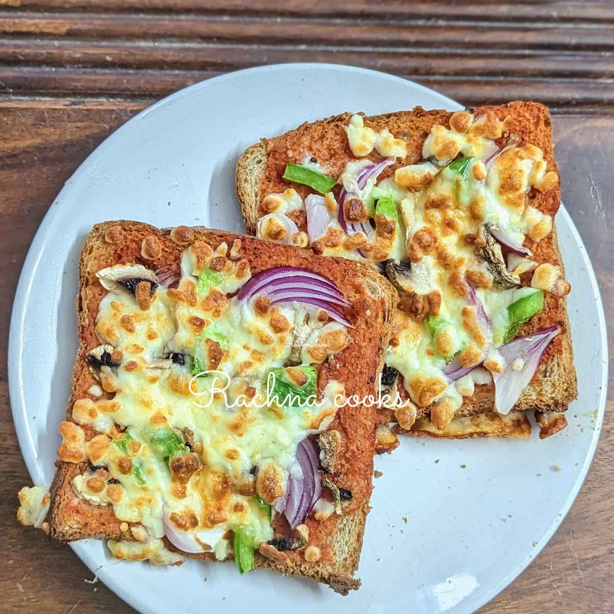 2 slices of bread pizza in a white plate.