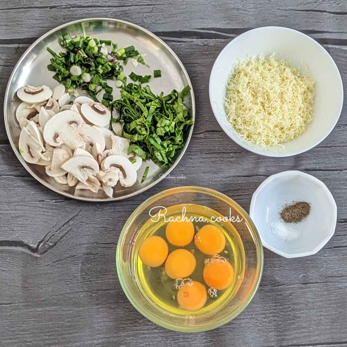 Ingredients for frittata in bowls: grated cheese, 6 broken eggs in a bowl, salt and pepper and chopped veggies in different bowls.