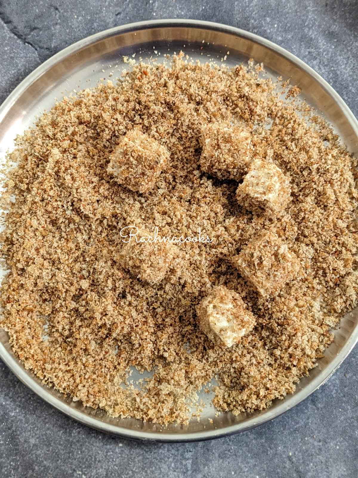 tofu bites immersed in breadcrumbs on a plate