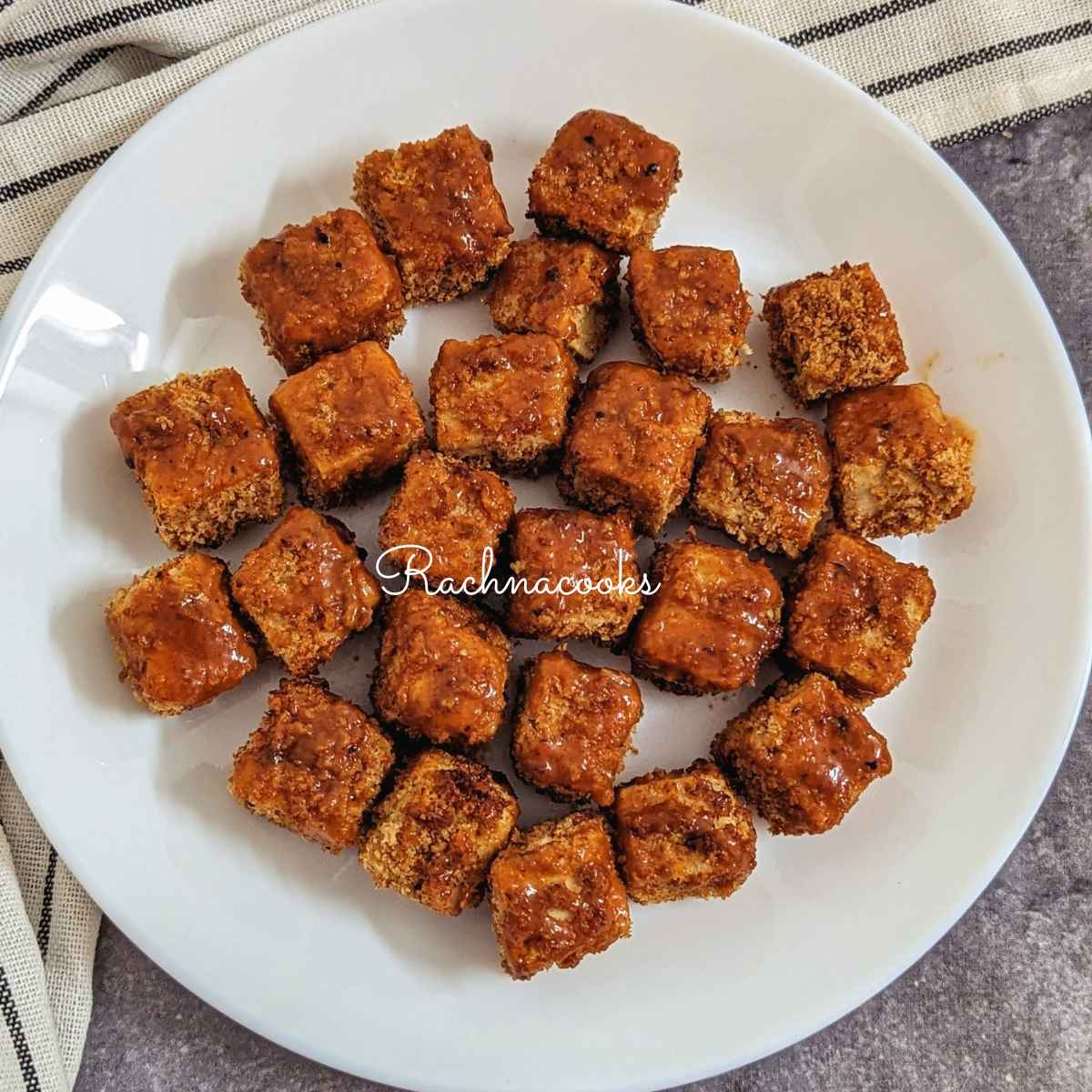 Buffalo tofu bites served on a white plate