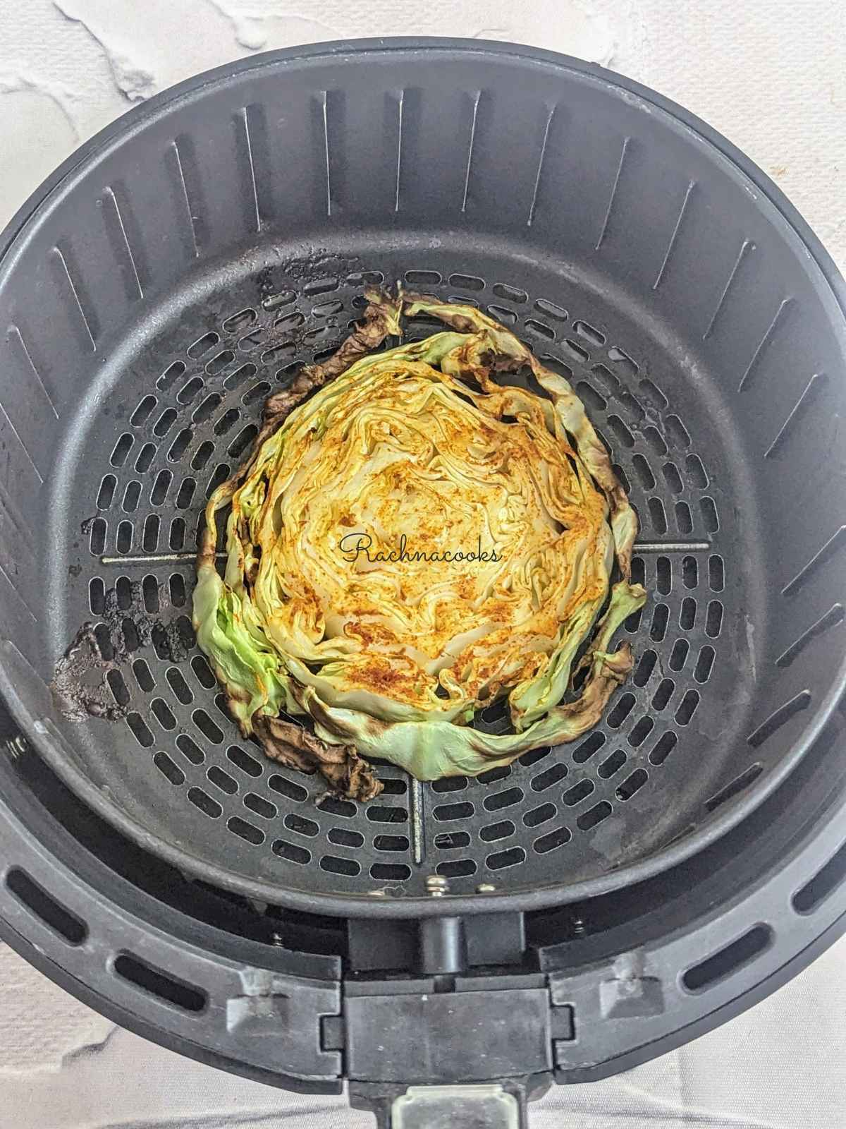 Air fried crispy cabbage steak in air fryer basket 