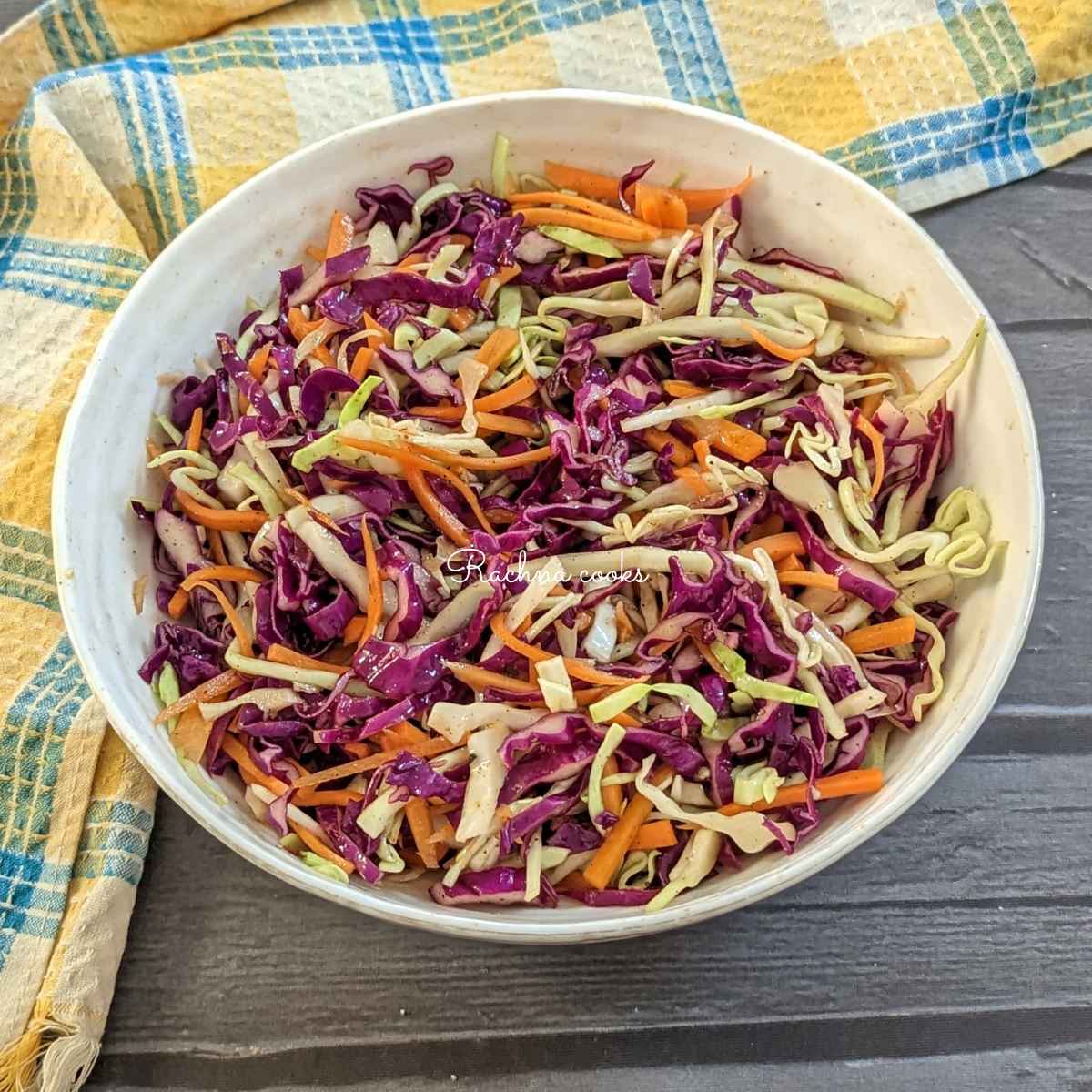 A large bowl of cabbage and carrot salad