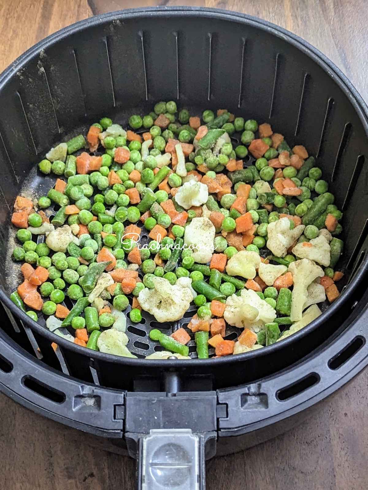 Frozen vegetables in air fryer basket