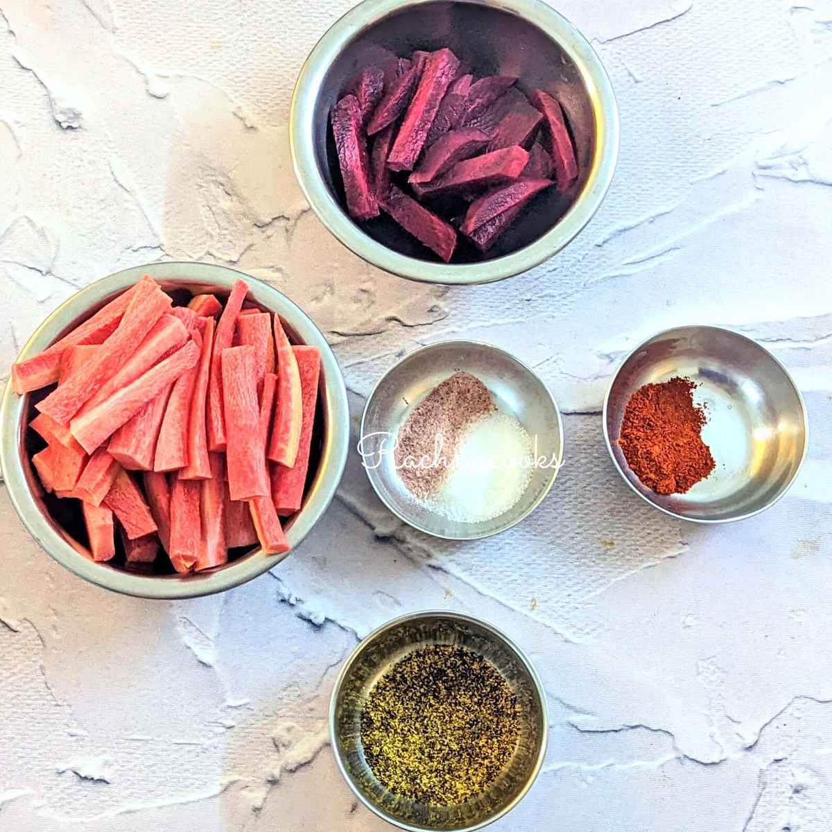 Ingredients for kanji: carrot batons, beet batons, cayenne, salt, pink salt and mustard powder.