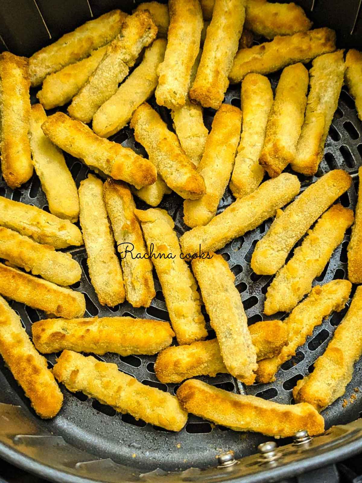 Golden air fried chicken fries in air fryer basket