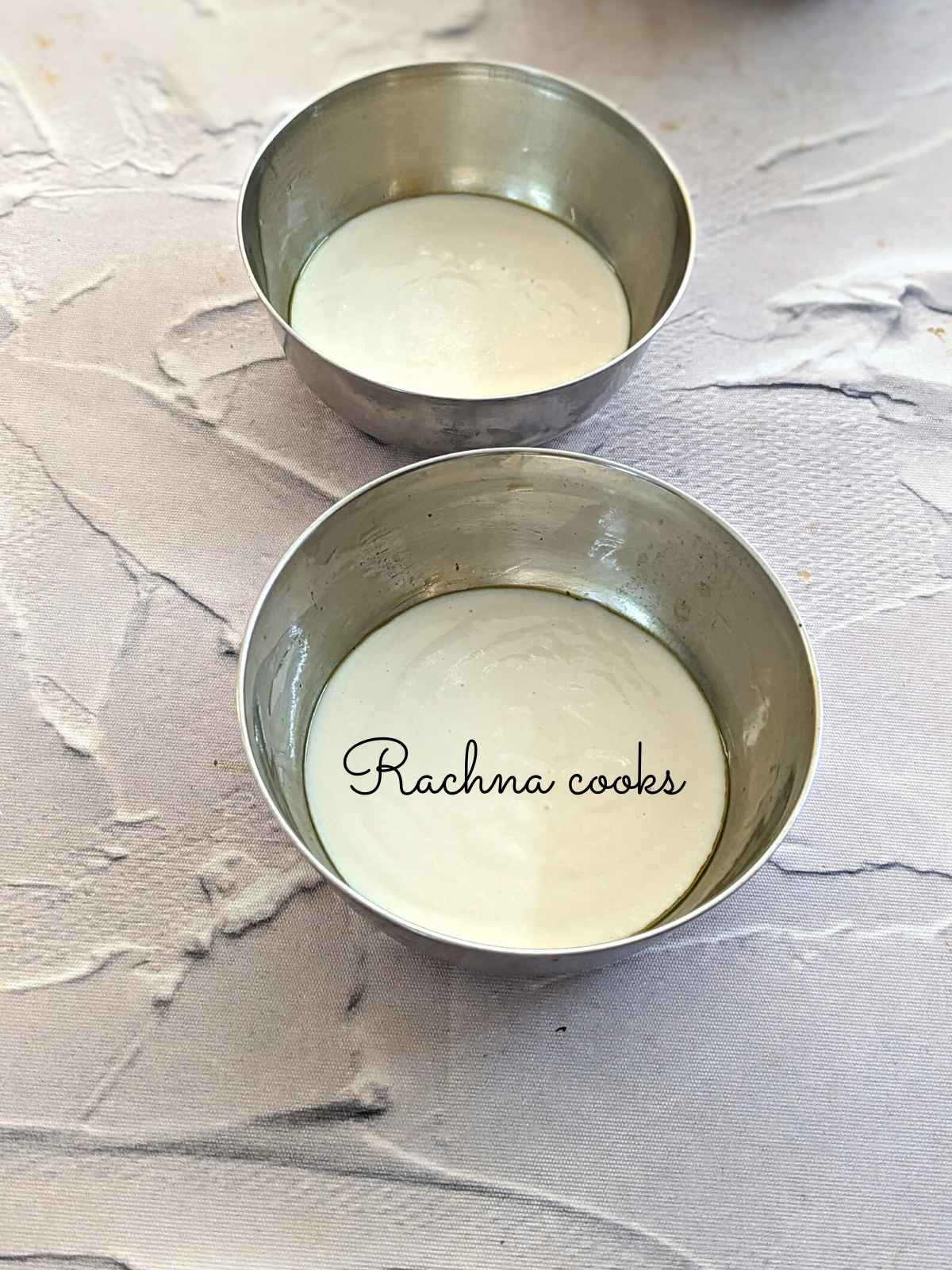 Pancake batter poured in two metal moulds