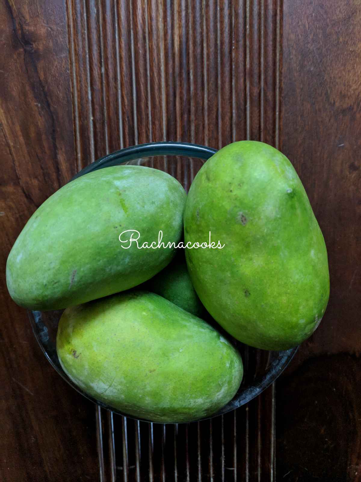 Green mangoes in a bowl