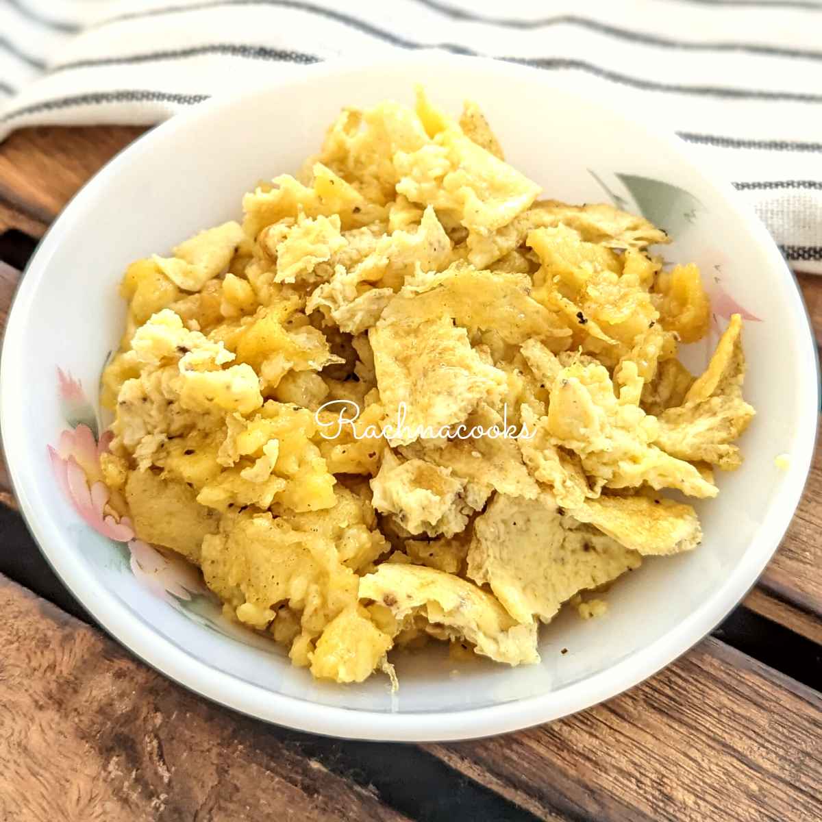 Air fryer scrambled eggs served in a white bowl