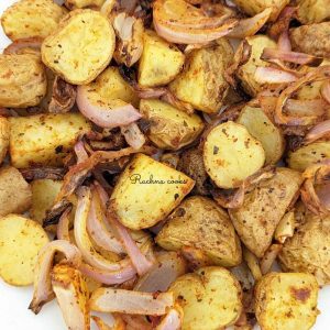 Close up shot of air fryer roasted potatoes and onions