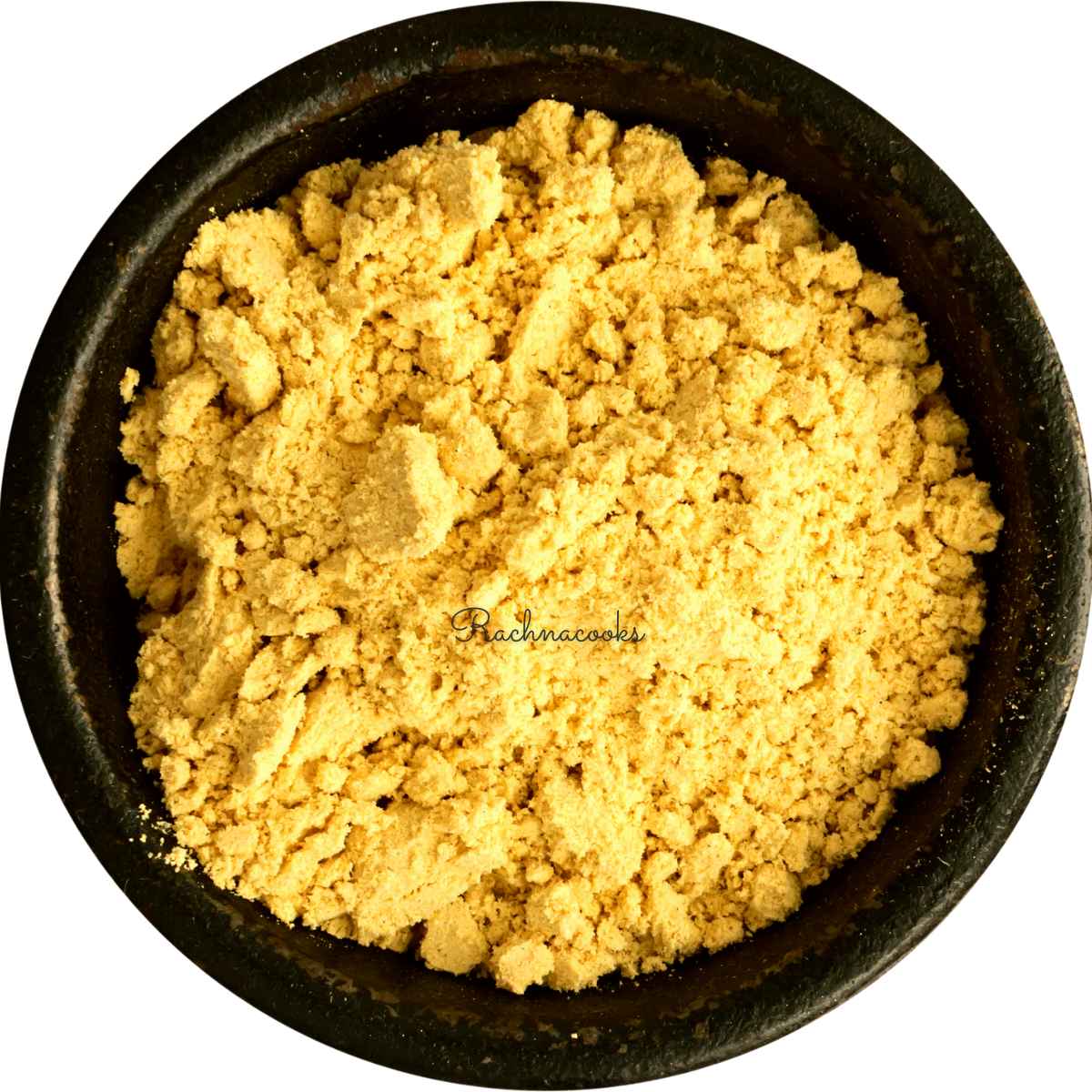 Mustard powder in a black bowl.