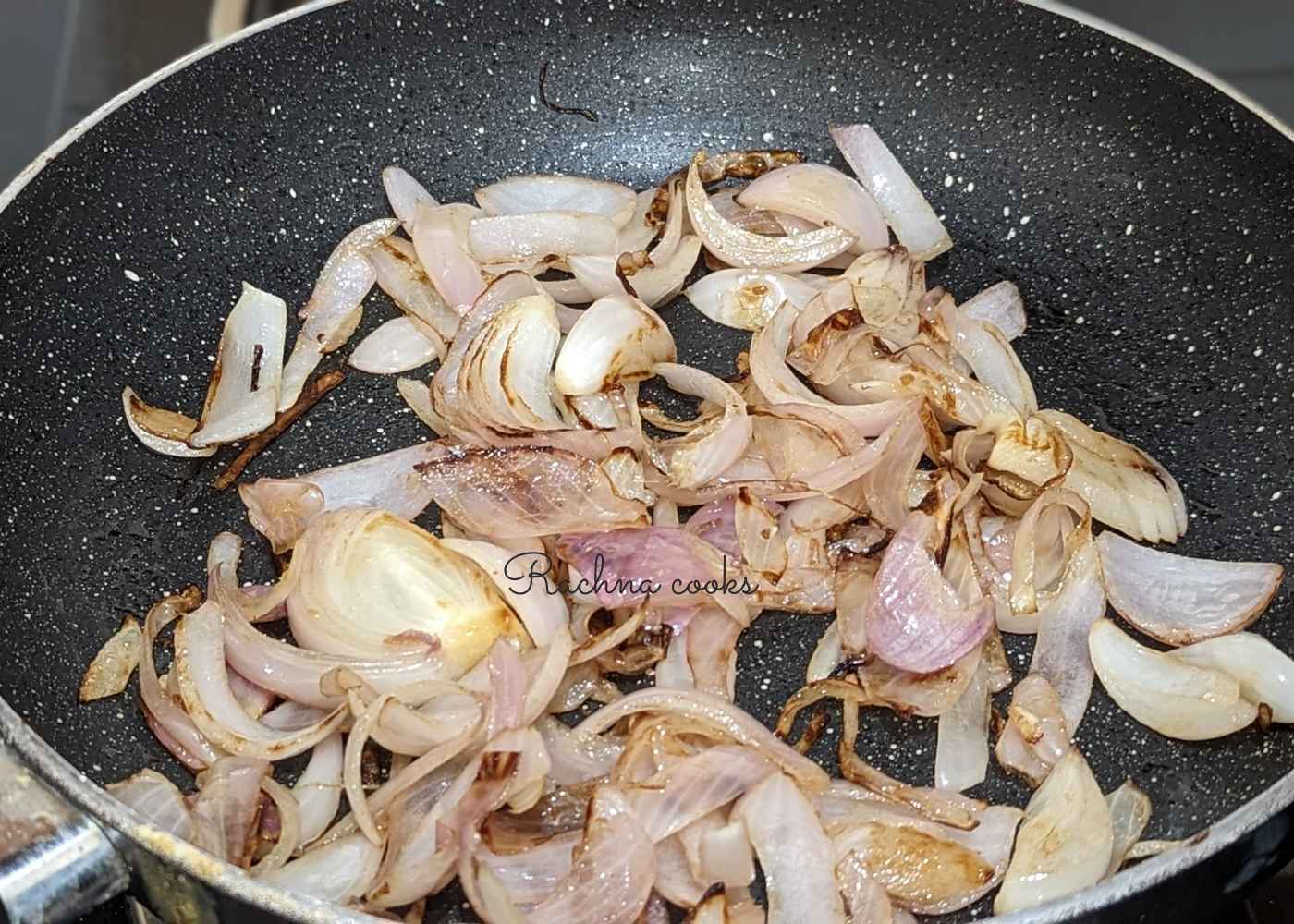 Sauteed onions in a pan.