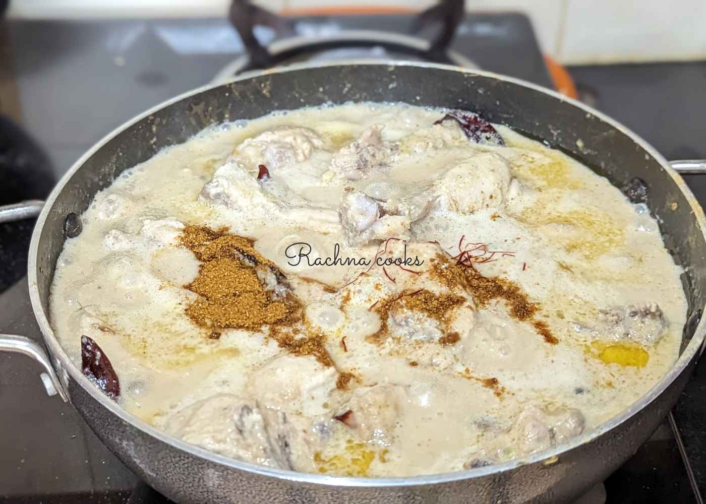 Garam masala, saffron strands and kewra water added to the chicken curry.