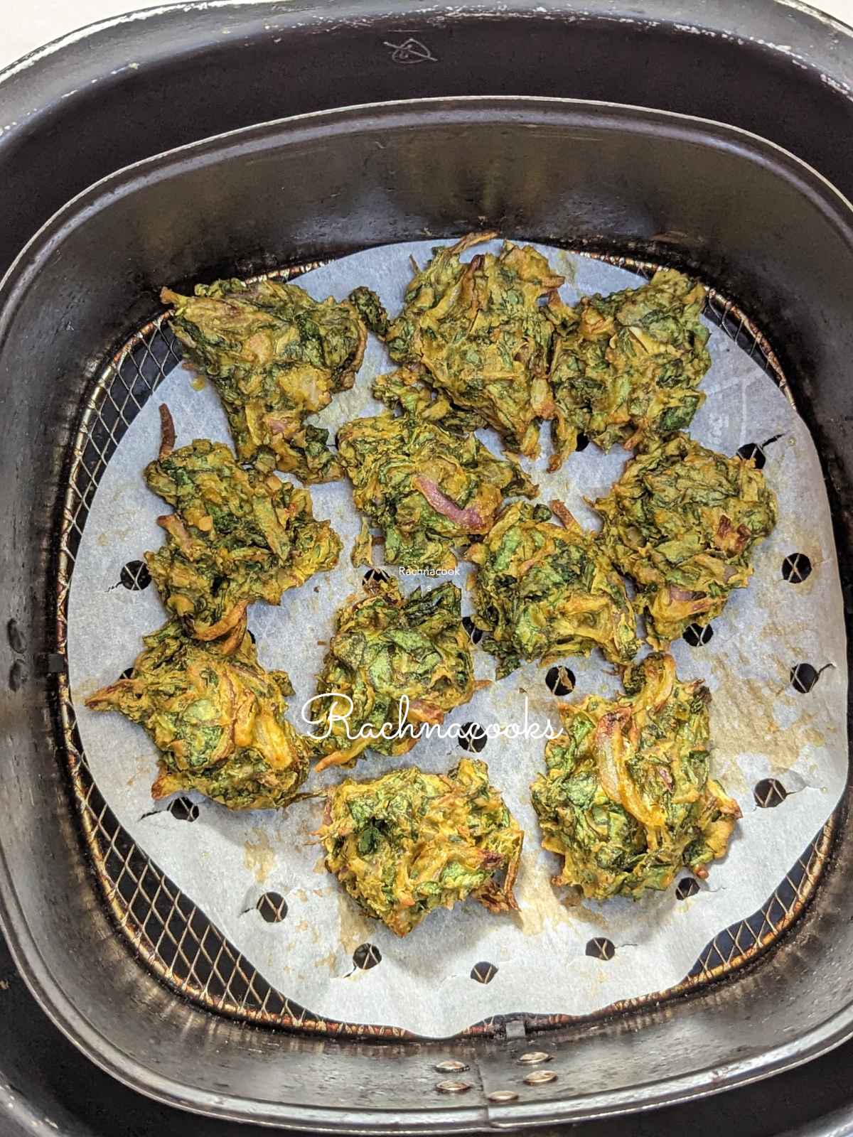 spinach pakoda after air frying in air fryer basket