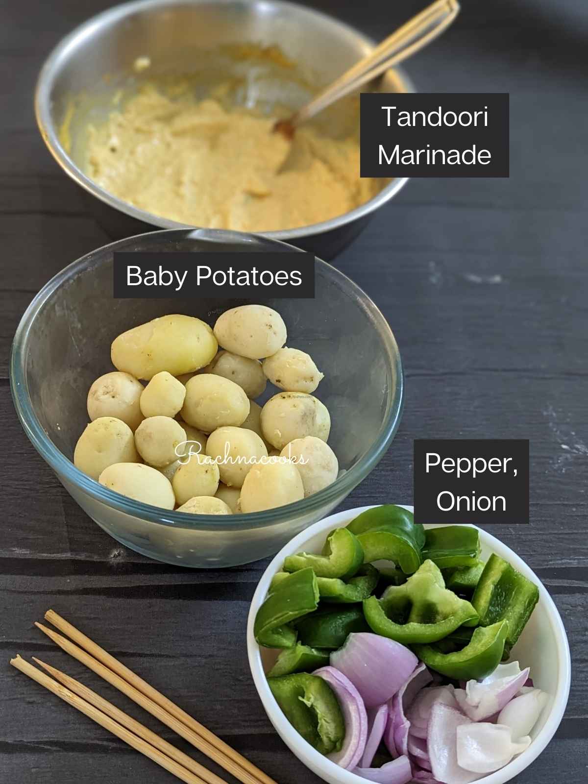 Ingredients to make tandoori aloo: marinade, baby potatoes, peppers and onion