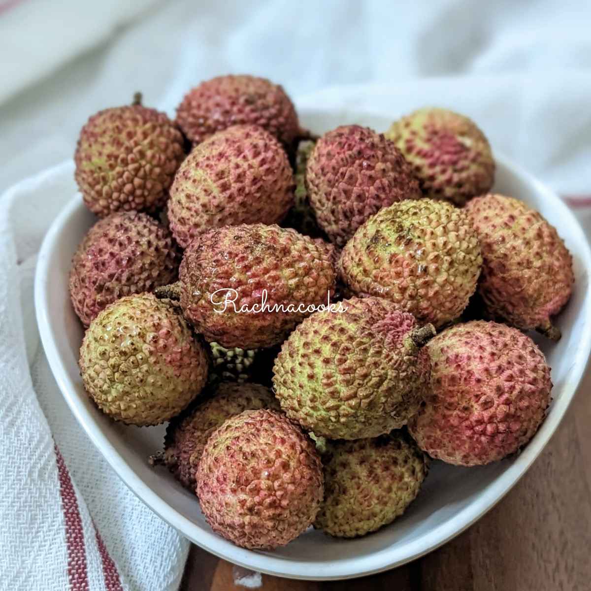 Rosy lychee fruits in a bowl