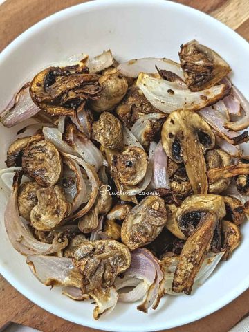 Air fryer mushrooms and onions served in a white bowl