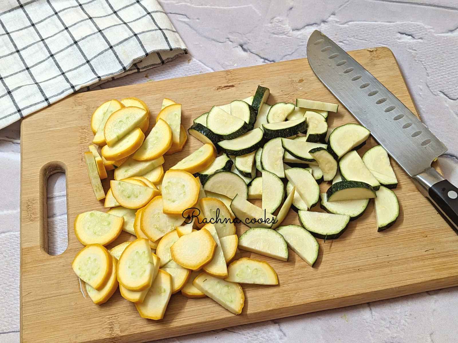 Sliced zucchini and squash on chopping board