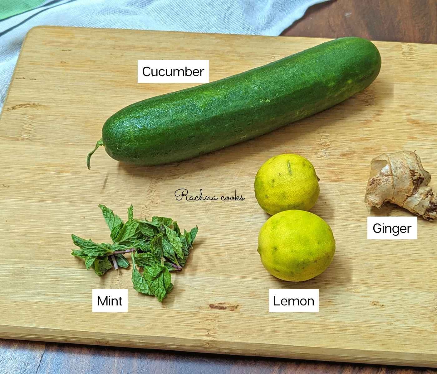 Cucumber, ginger, lemon, mint on a chopping board.