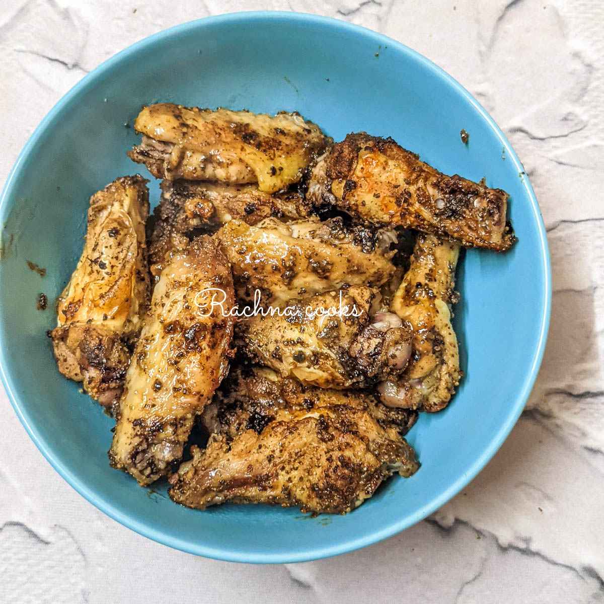 Chicken wings served in a blue bowl