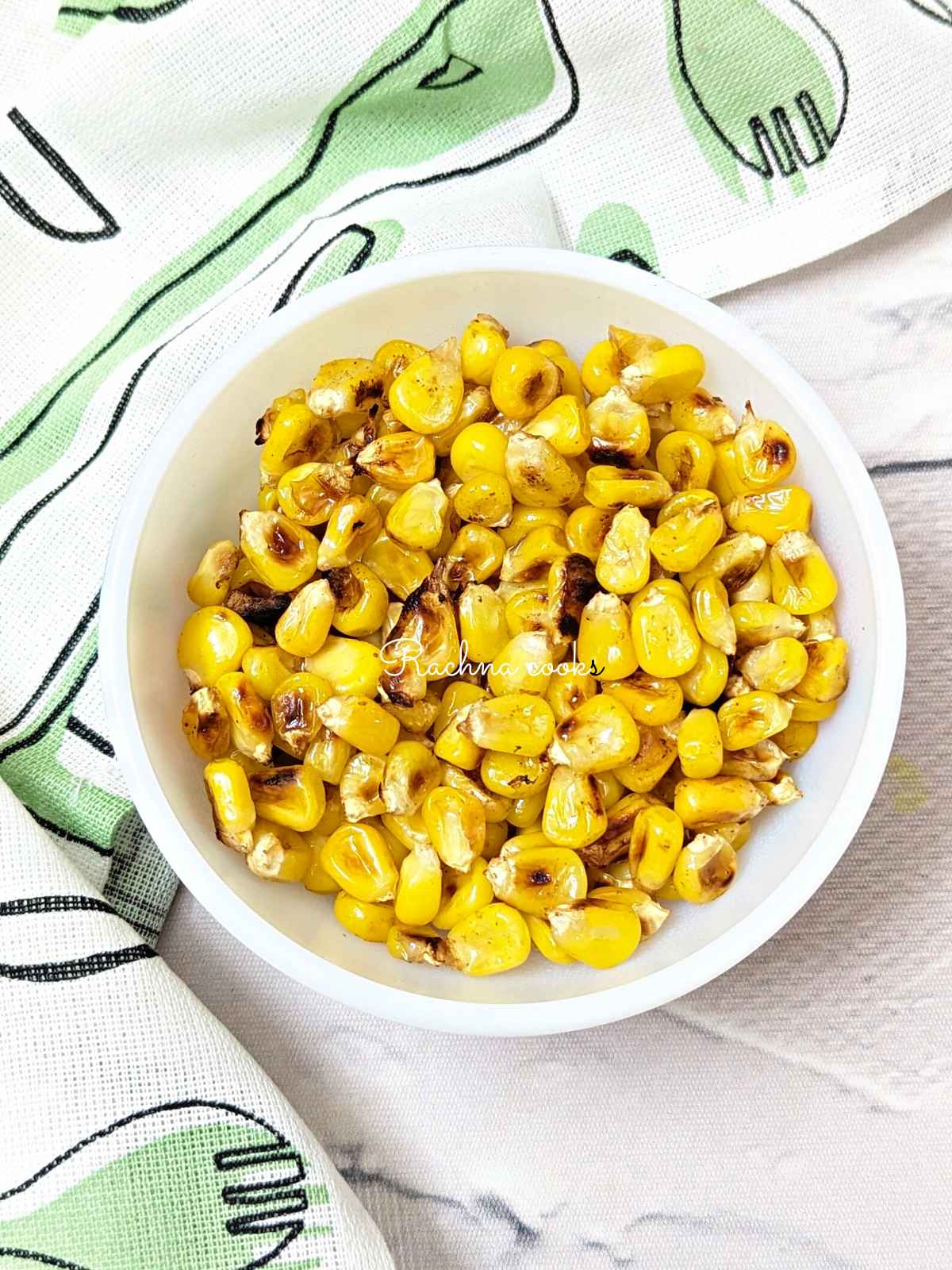 A bowl of charred corn kernels