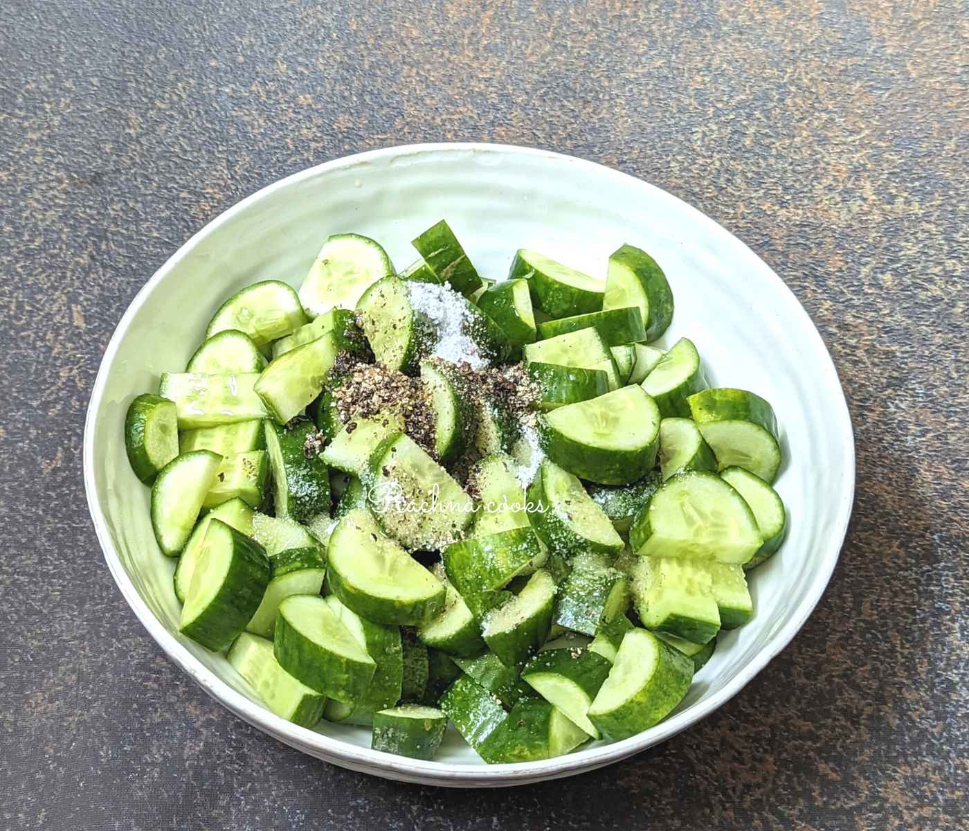 Cucumbers with sprinkled salt, pepper, garlic and olive oil
