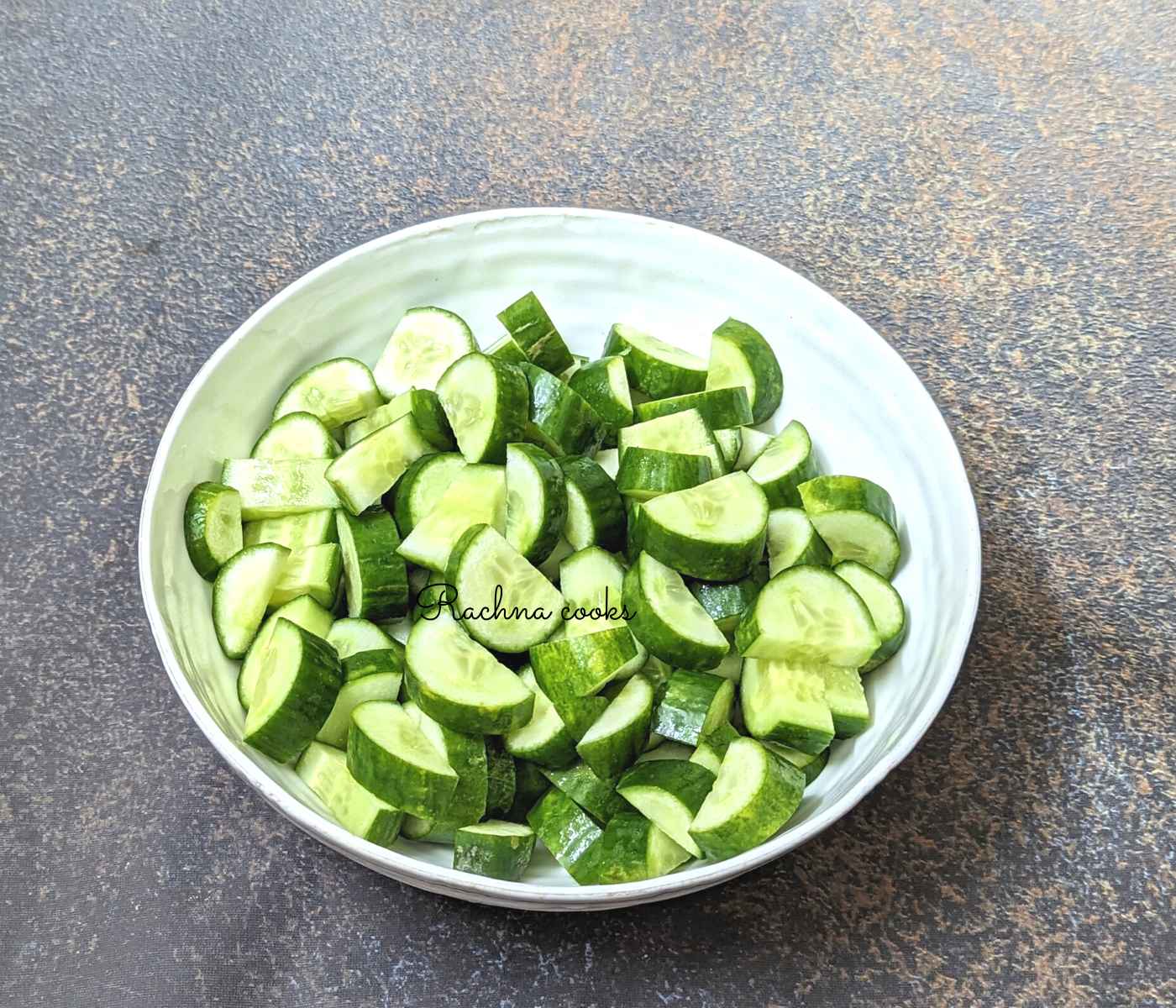 Cucumber cut into half moons in a bowl