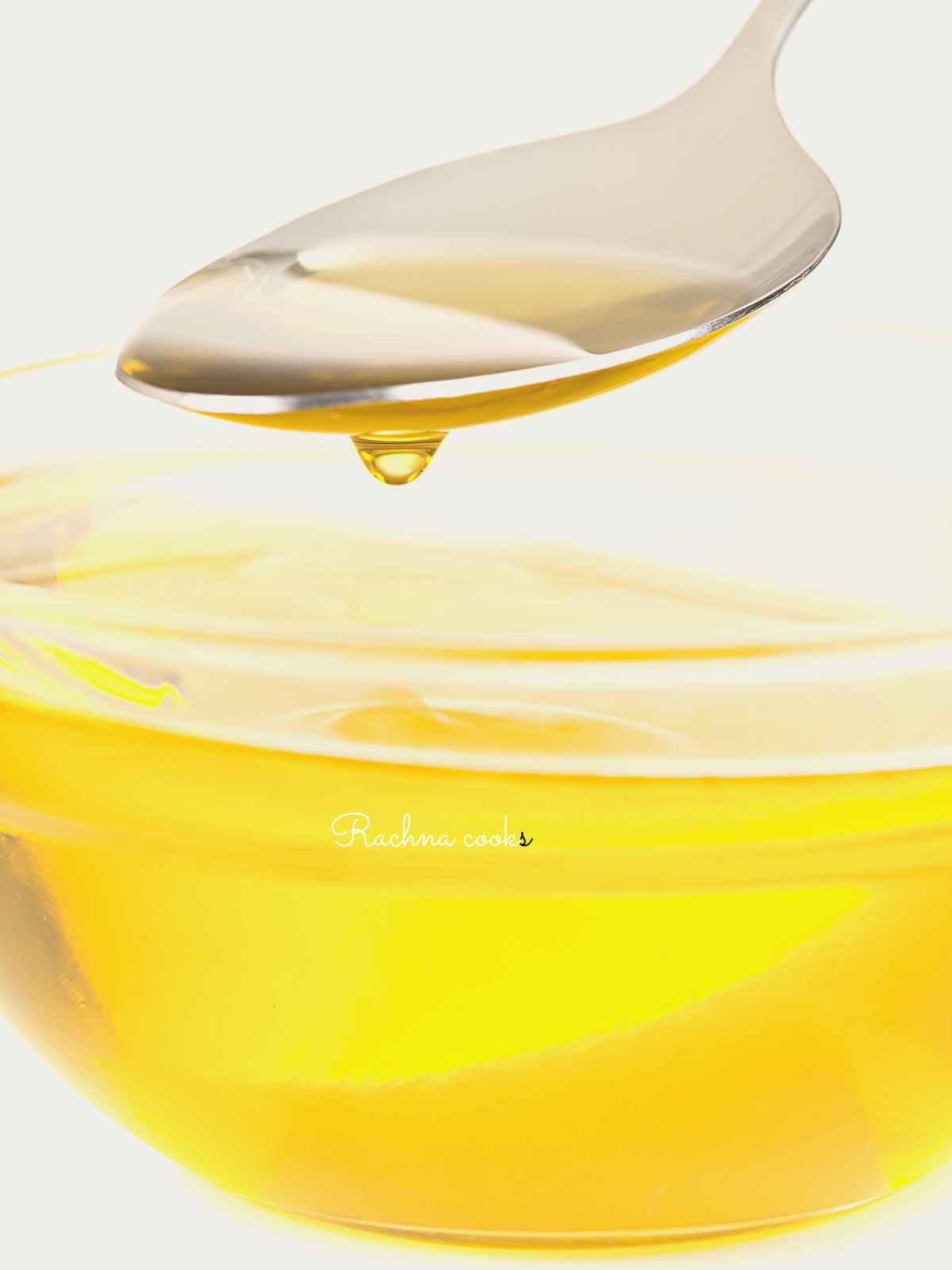 A teaspoon with oil dripping.