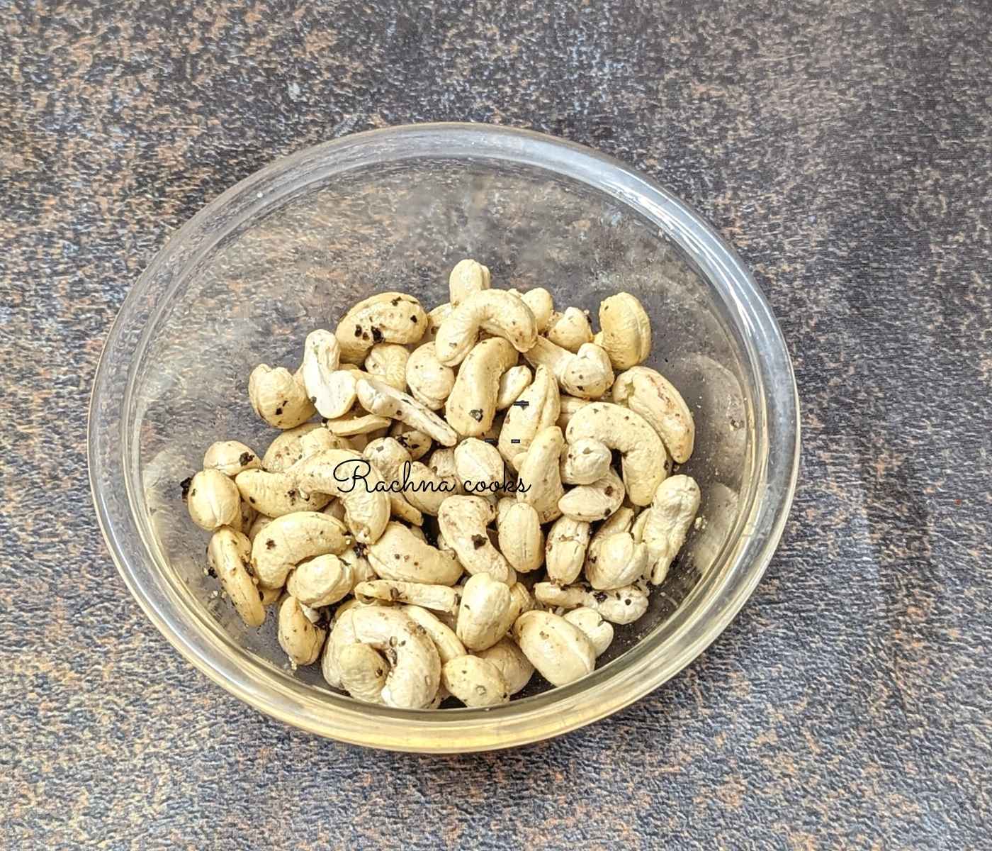 Cashews mixed with oil, salt and pepper