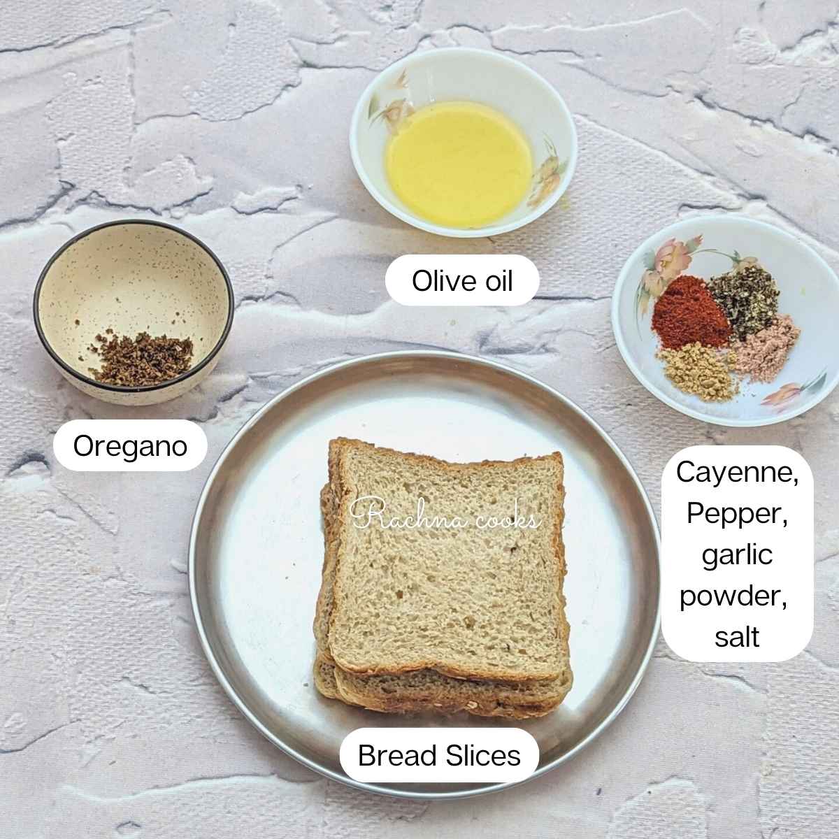 Ingredients for making air fryer croutons: bread slices, seasonings and olive oil