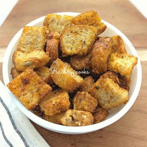 Air fried croutons served in a white bowl.