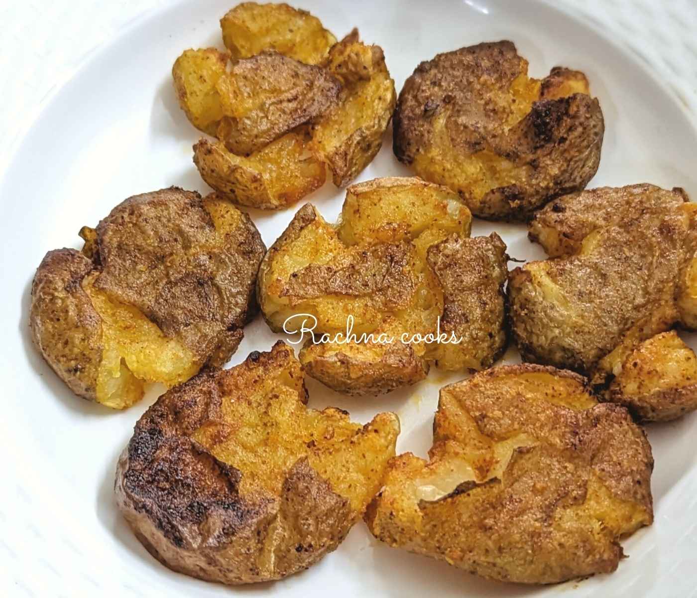 Delicious smashed air fryer potatoes served on a plate.