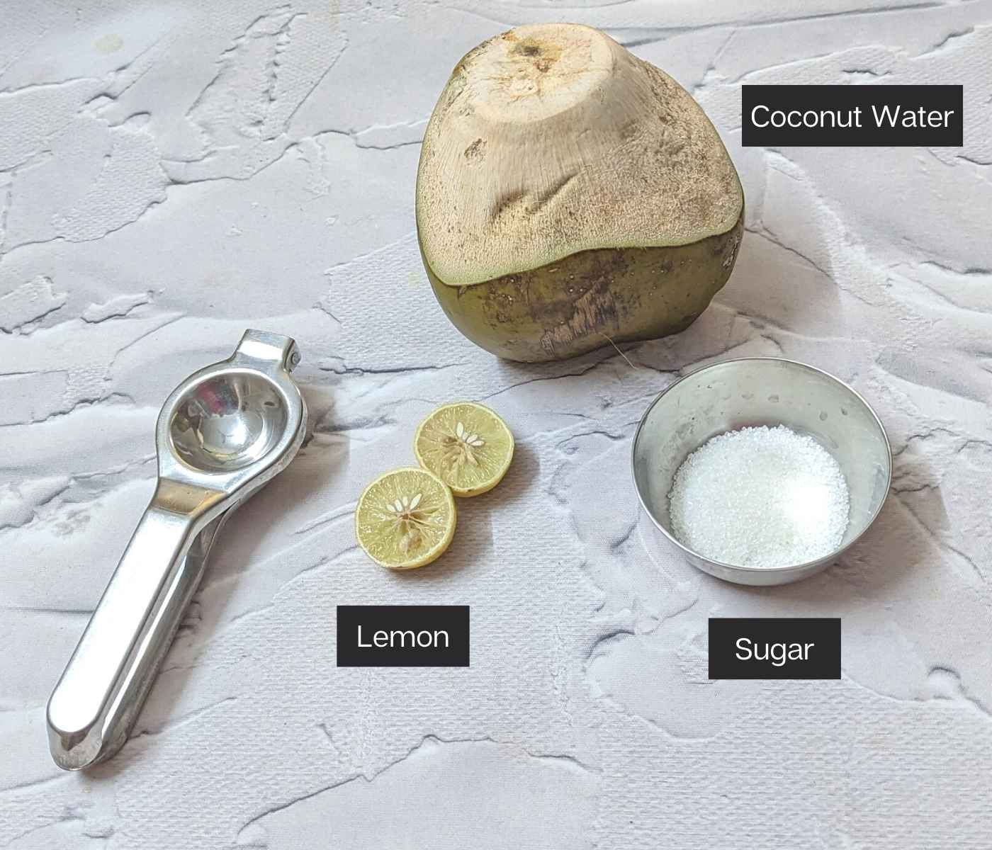 Tender coconut, lemon and sugar on a frame.