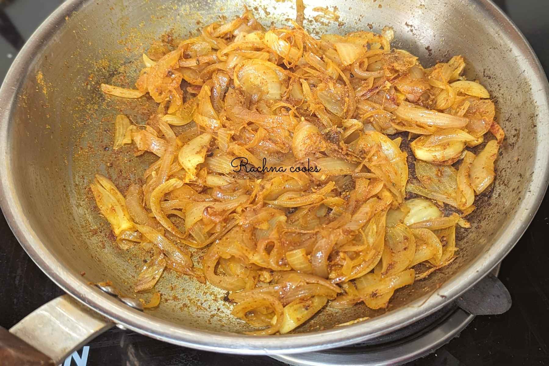 Sliced onion filling wth spices is ready in a pan