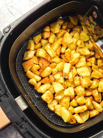 air fryer roasted potatoes in air fryer basket
