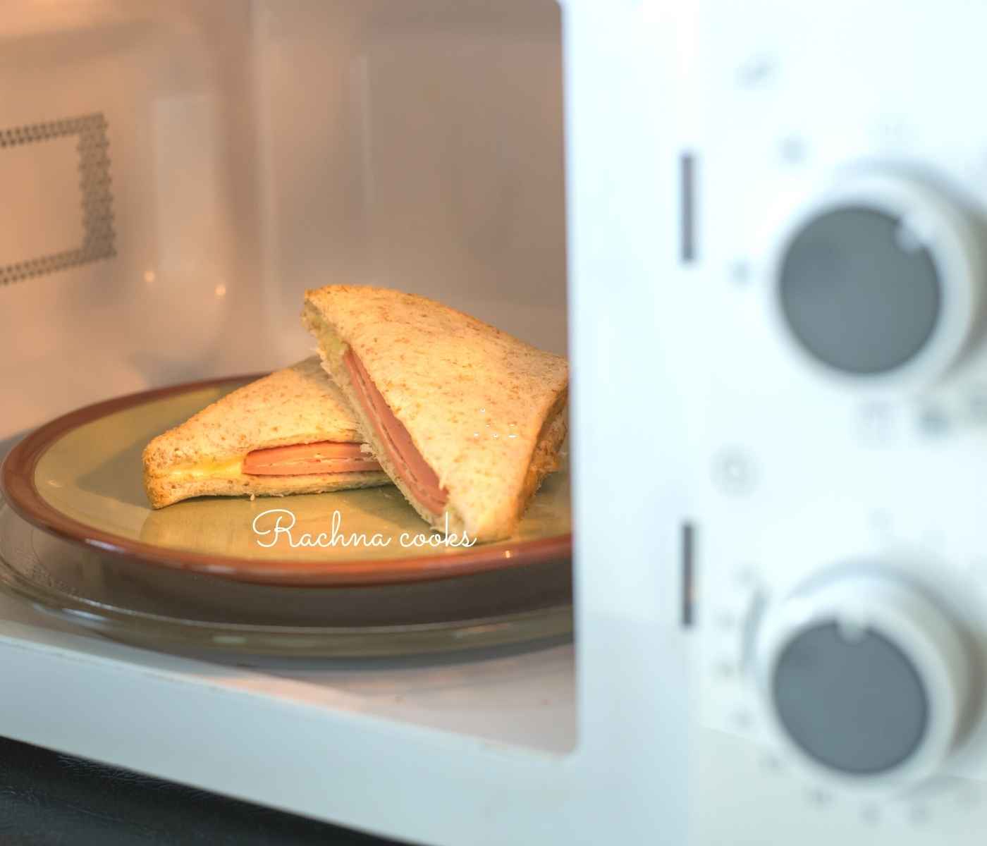 Two halves of sandwich in a microwave