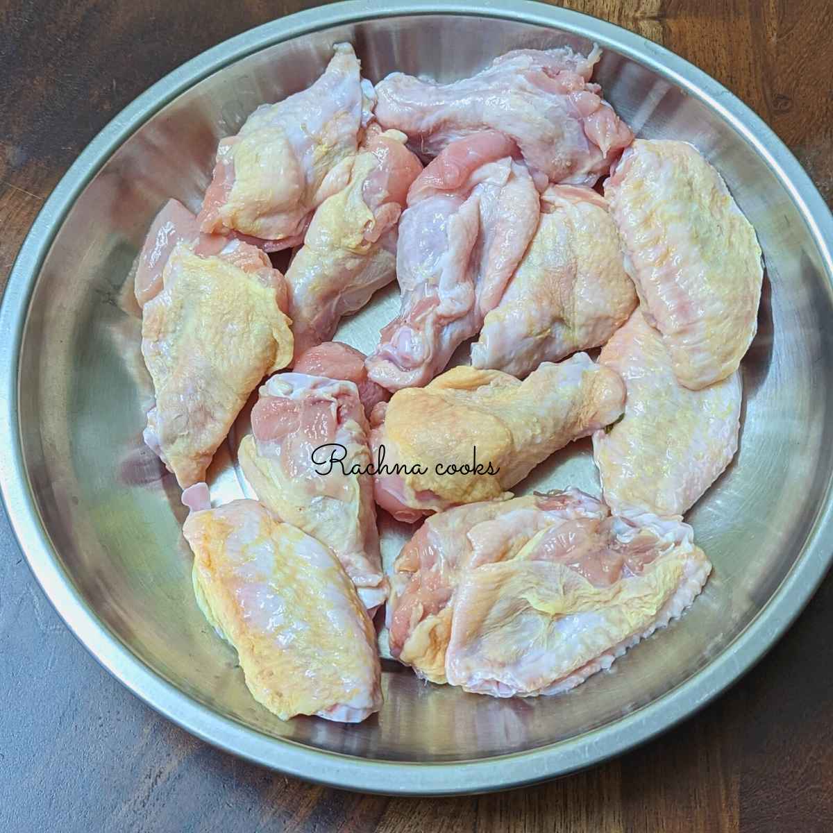 Chicken wings with skin in a plate.