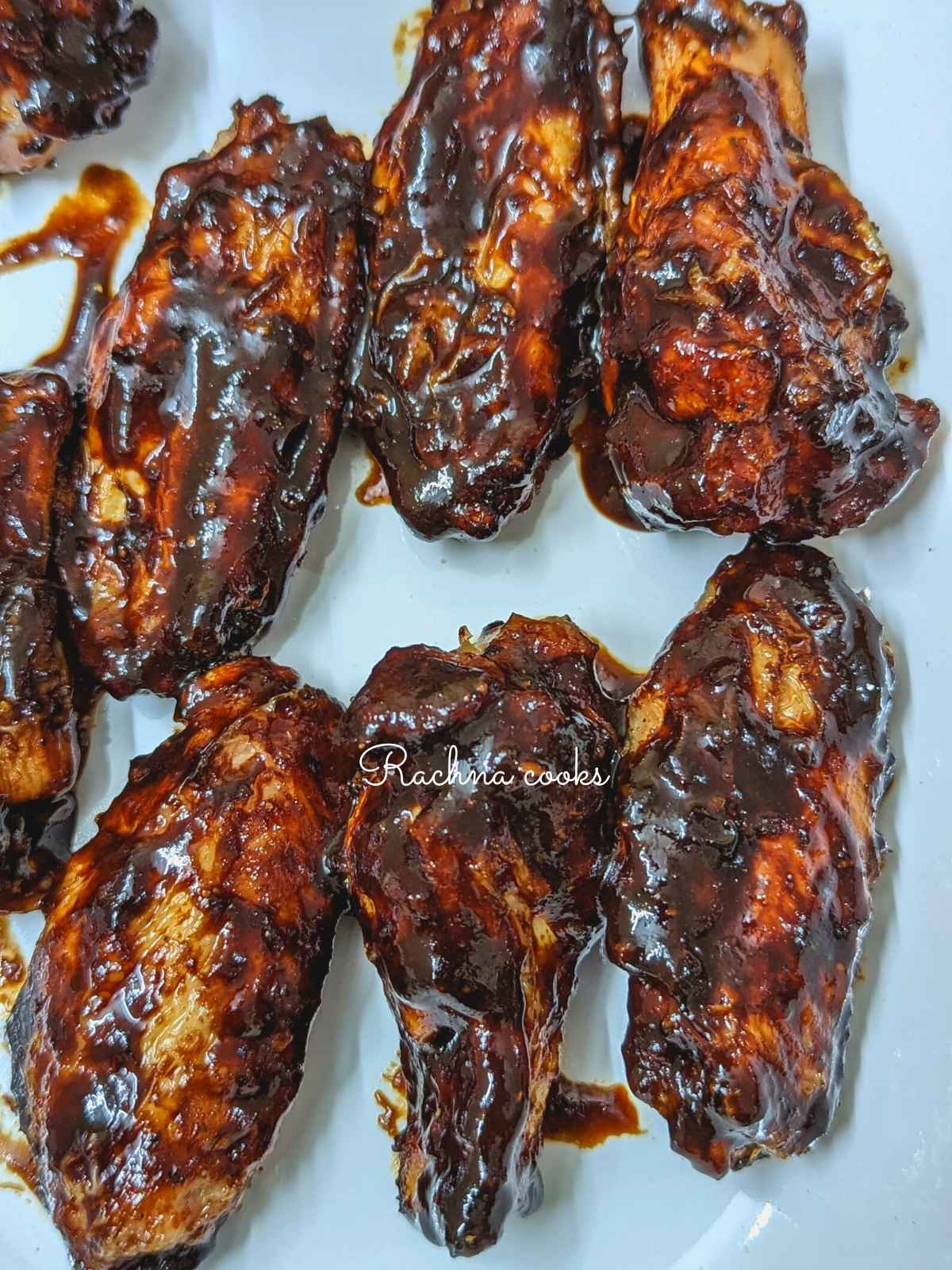 Korean chicken wings served on a white platter