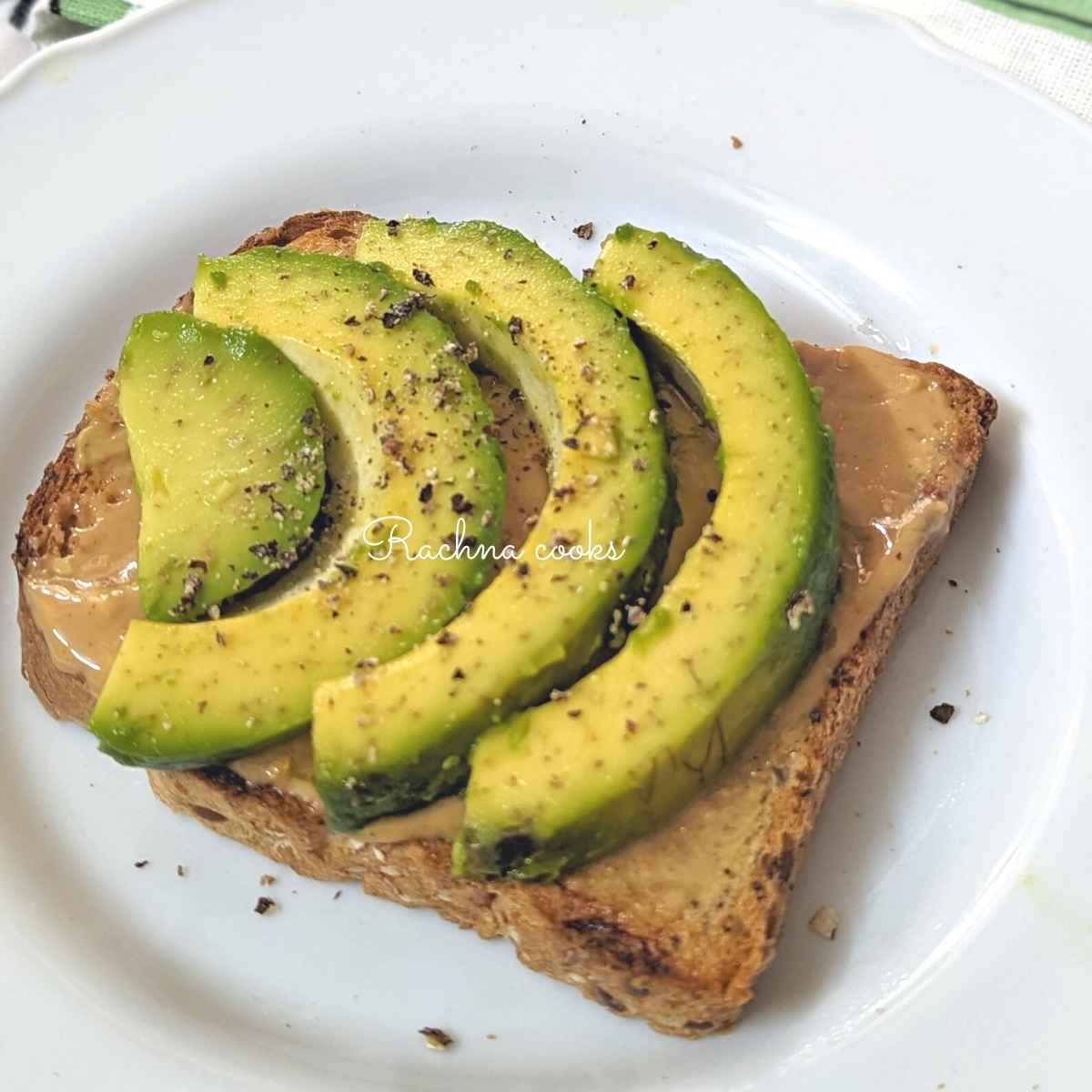 Peanut butter toast with avocado slices