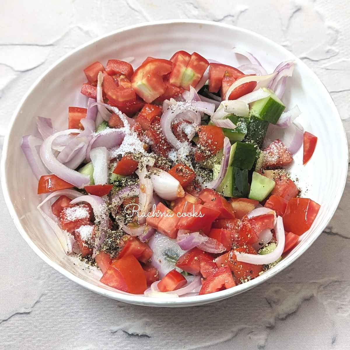 Diced tomato, cucumber and onions with salt, pepper and olive oil and red wine vinegar.