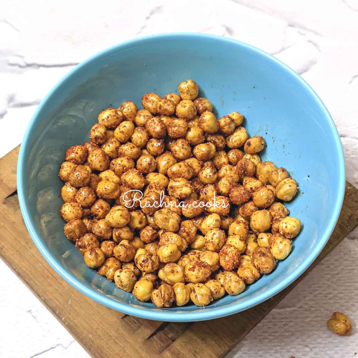Spicy crispy air fried chickpeas in a blue bowl