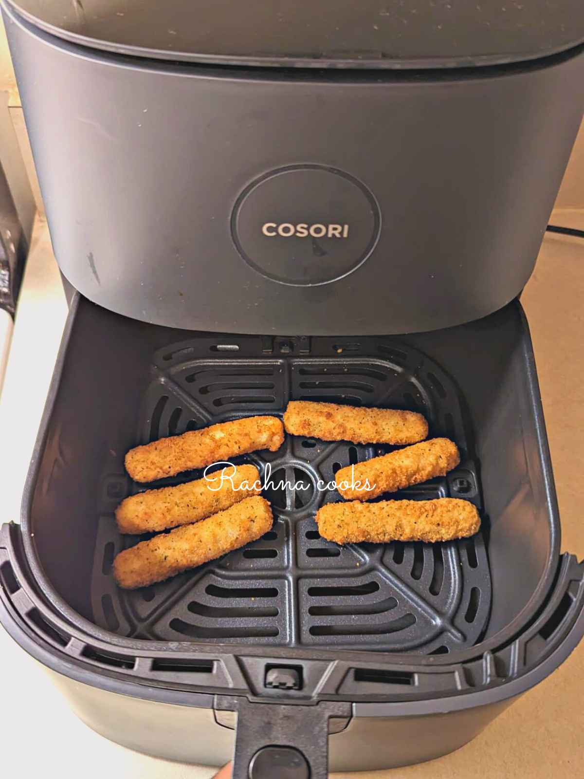 Mozzarella sticks after air frying in Cosori air fryer.