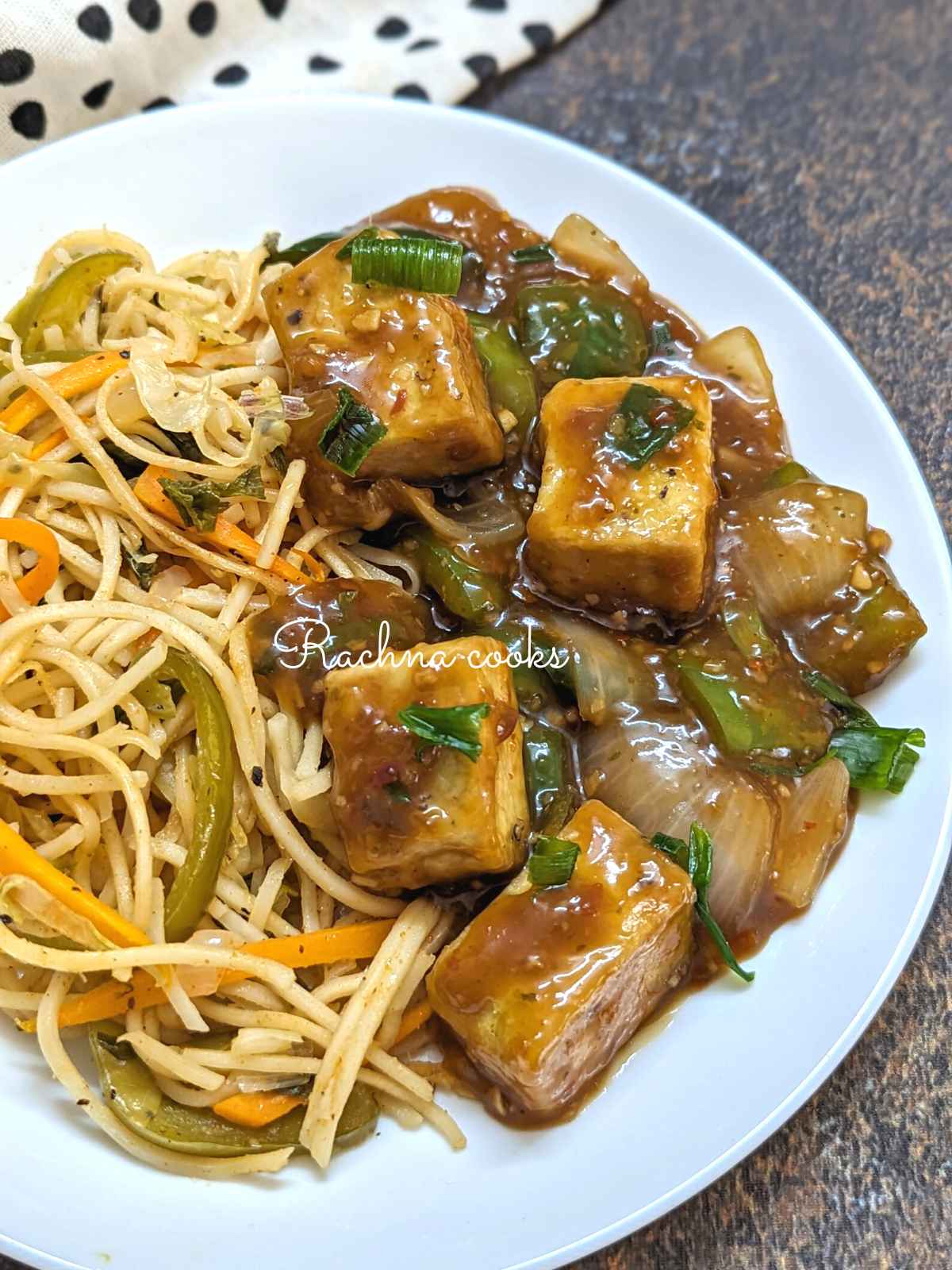 Tofu manchurian served with noodles.