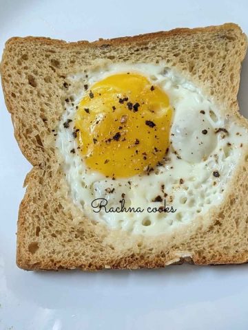 Air fryer egg toast served on a white plate.