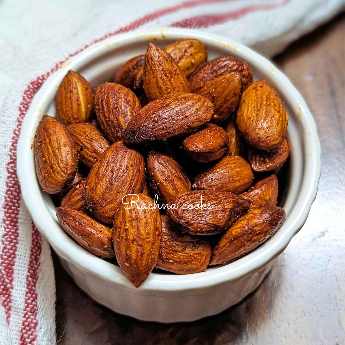 Close up of a bowl of roasted almonds.