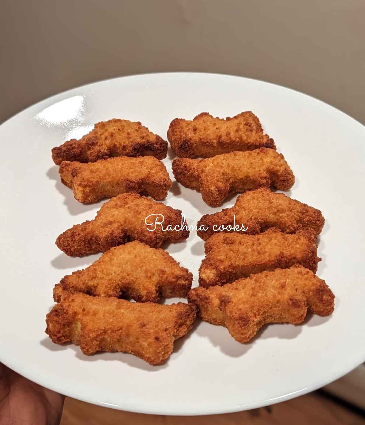 Air fried dino nuggets served on a plate.