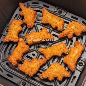 Dino nuggets after air frying in air fryer basket